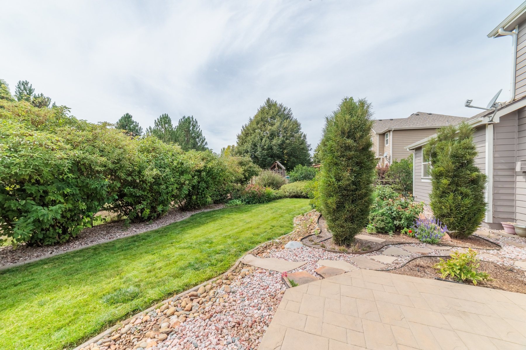 Professionally landscaped backyard at 11806 N Beasly Rd